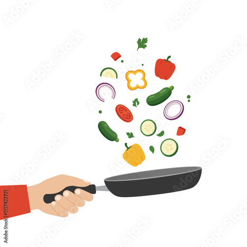 A hand tossing vegetables in a frying pan