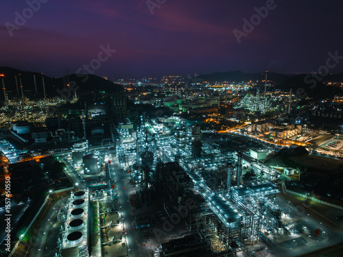 Φωτογραφία Aerial view oil and gas storage tank, oil refinery factory plant at night form i