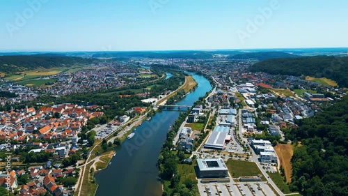 Befreiungshalle in Kelheim, Germany, captured from a drone on a bright summer day. This impressive circular monument stands above the Danube, surrounded by lush green landscape