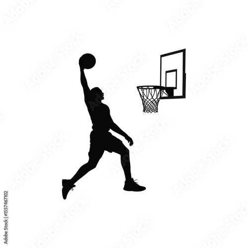Basketball player silhouetted dunking ball towards the hoop with dynamic movement