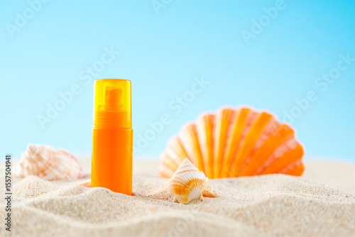 Orange Sunscreen Spray Bottle with Colorful Scallop Seashells on Sandy Beach Against Turquoise Ocean