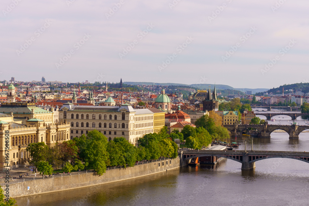 Fototapeta premium Panoramic view of Prague with Vltava River and historic bridges