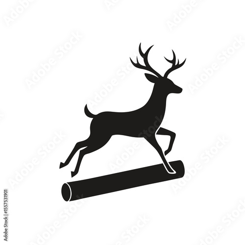 Silhouette of a deer powerfully jumping over a fallen log in mid air showcasing a dynamic and athletic pose in nature