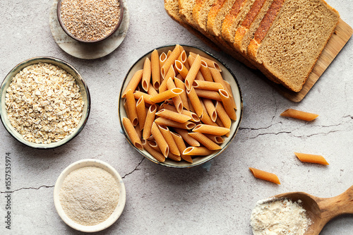 High-fiber foods, including wholegrain pasta, organic oats, and whole wheat flour and bread.