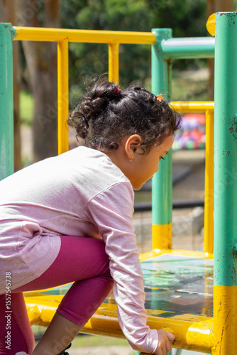 Daughter playing in backyard playground