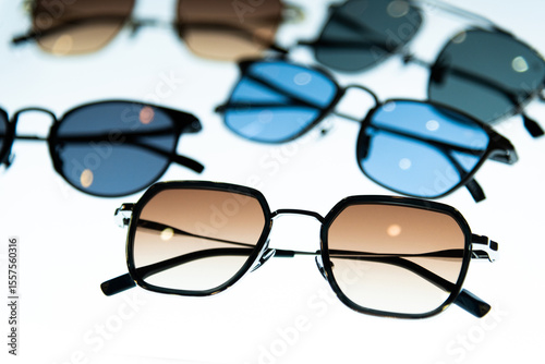 Many sunglasses are displayed in the store
