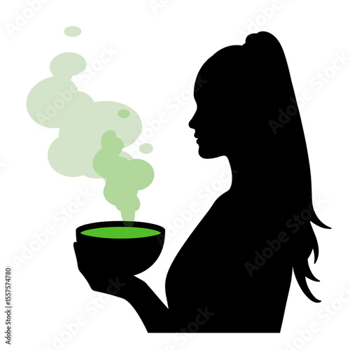 Silhouette of person holding steaming bowl of green soup, detox meal concept