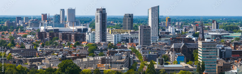 Φωτογραφία Aerial view of Eindhoven, Netherlands, showing Philips Stadium, Vesteda Tower, Admirant, modern and traditional architecture, greenery, and a flat horizon