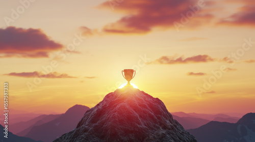 Glowing trophy atop mountain peak under vibrant sunrise symbolizing motivation and achievement
