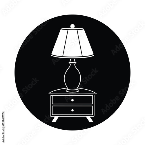 Modern table lamp with a classic dome shade casting a warm glow presented in a clean silhouette style