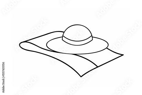 Wide brim hat resting on folded fabric accessory