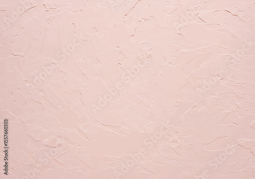 Light pink plaster wall background with decorative stucco and subtle abstract texture, elegant interior surface ideal for artistic wallpapers and modern design projects