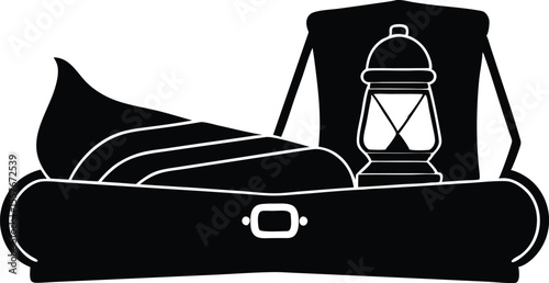 sleeping bag and lantern in open truest