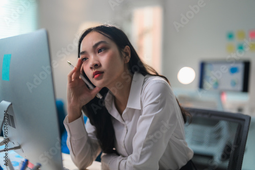 Tableau sur toile Tired employee working with desktop computer, suffering from headache or migrain