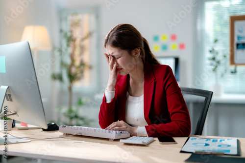 Obraz na plátně Young manager suffering from eye strain and fatigue, rubbing her eyes while sitt