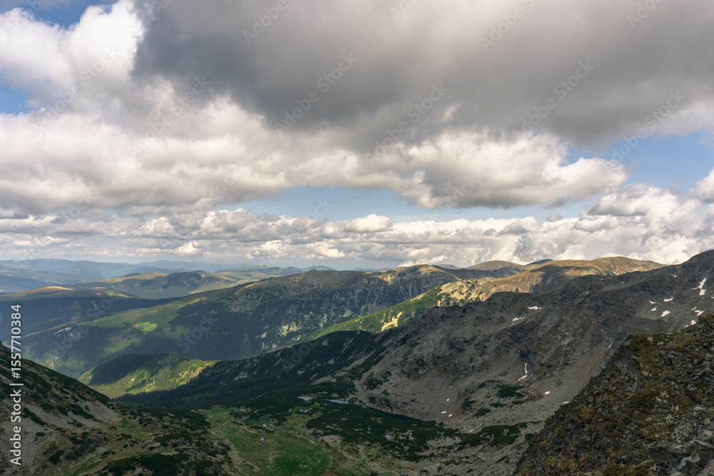 Naklejka premium mountain landscape with clouds carpathians with lakes down