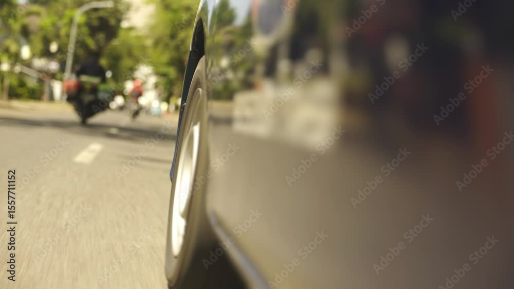 Close-Up of Old Car Tire Rolling on the Road – Dynamic Driving Footage