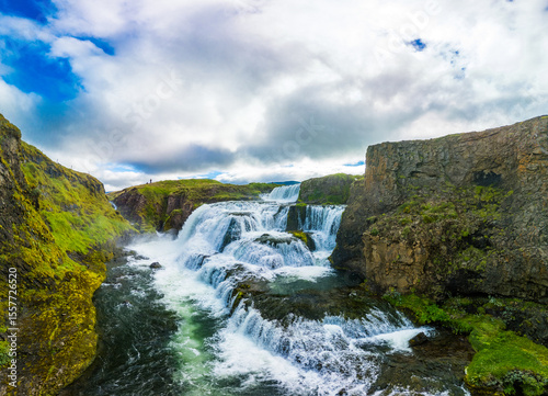 Aerial drone view of Fosslaug waterfall, Iceland