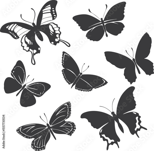 A group of silhouette butterflies are isolated against white, with varying shapes and sizes spread around