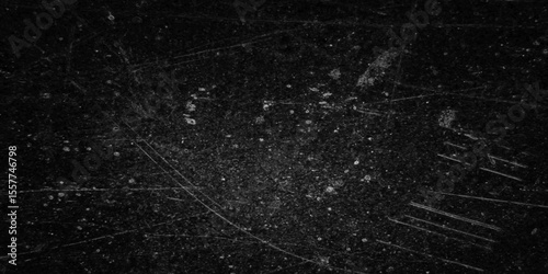 Grungy black surface with numerous white crack and scratches and dust particles distressed background. abstract chalk rubbed out on blackboard for background. dirty grunge texture vector. black paper.