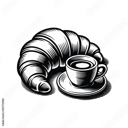 Classic french croissant and hot coffee in a cup on a saucer