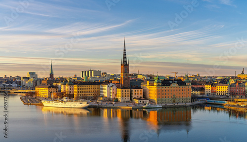 Canvas Print Historic buildings and Riddarholmen Church reflecting in Stockholm waters