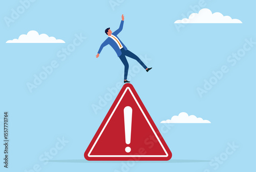 Vector illustration of a businessman struggling to maintain balance while standing on a giant warning sign, symbolizing risk, uncertainty, and navigating critical business challenges
