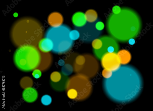 Colorful blurred circles with smooth glow and layered transparency on black background. Random soft shapes form festive abstract depth with no symmetry or focal point.