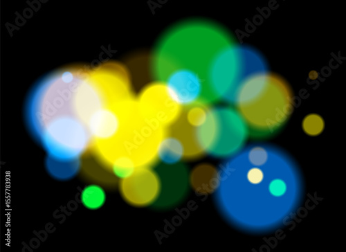 Colorful bokeh. Soft blurred circles in pink, blue, orange tones on dark background create dreamy abstract atmosphere with layered transparency and glowing effect.