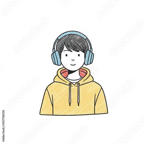 Young man wearing headphones and smiling in casual yellow hoodie  