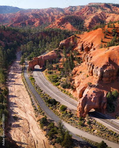 Scenic Byway in Southern Utah Toward Bryce Canyon National Park With Towering Sandstone Cliffs and Red Stone Tunnels Drone Photography