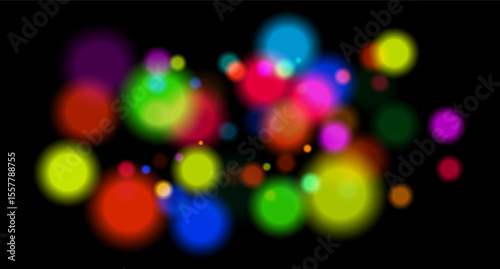 Multicolored glowing circles on dark background. Blurred soft shapes of various sizes create abstract festive atmosphere.