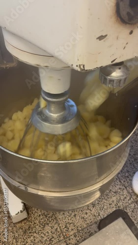Industrial planetary mixer stirs boiled potatoes