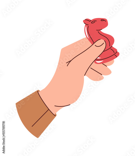 Human hand holding chess horse
