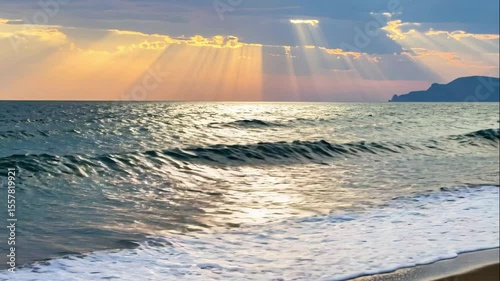 Golden Sunset over the Serene Ocean: Experience the sun's golden embrace as it kisses the serene ocean with rays of light filtering through the clouds, a moment of peaceful reflection.