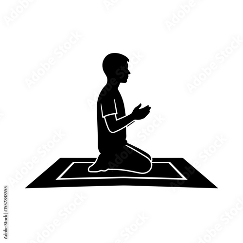 Man praying on a prayer mat in airport concept of Things to do in airport  