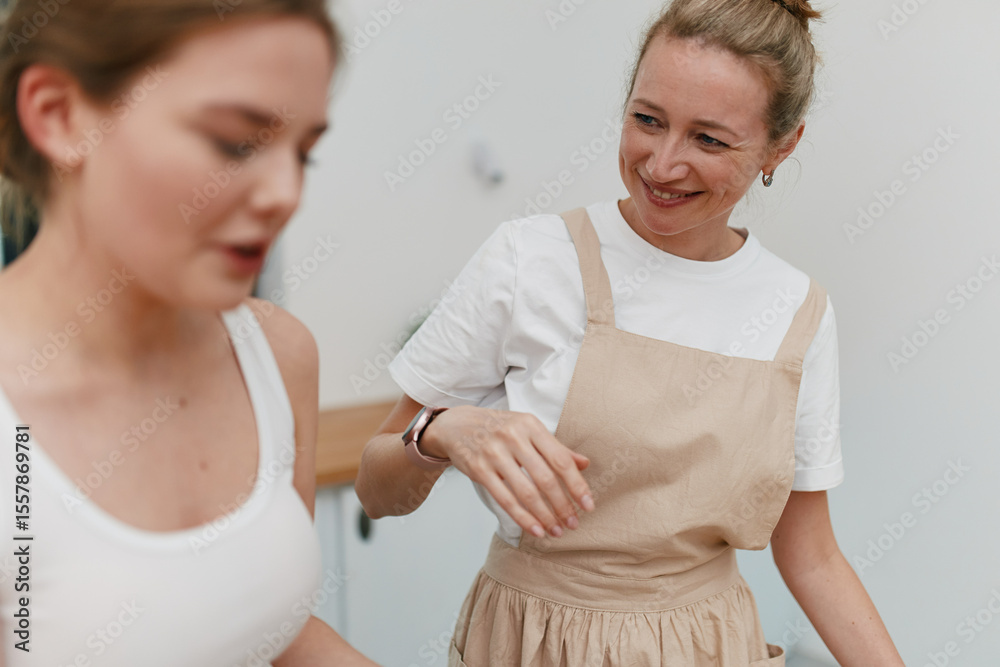 Fototapeta premium Middle age woman smiling and engaging in an active healthy lifestyle, promoting wellbeing and fitness in a positive community environment.