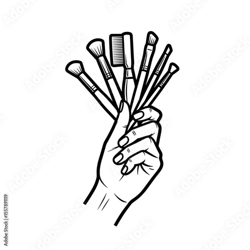 Hand holding a variety of makeup brushes, symbolizing beauty and artistry in cosmetics
