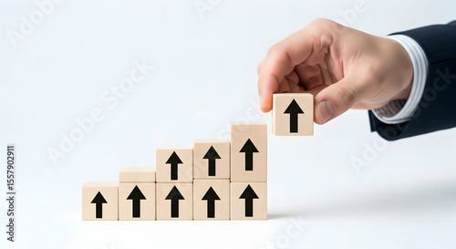 Stairway to Success: Hand Placing Arrow Block for Growth