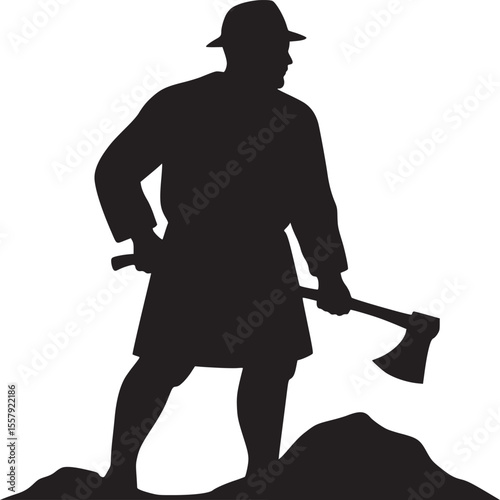 Silhouette of a lumberjack standing on a mound holding an axe wearing a hat and jacket in black and white