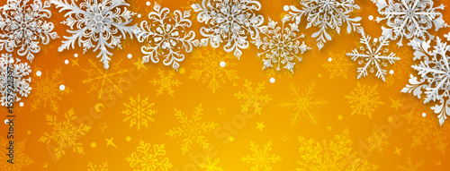Christmas illustration featuring intricate paper snowflakes of varying sizes and designs arranged on top, white on a yellow background with silhouettes of smaller snowflakes.