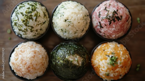 Six Colorful Rice Balls with Varied Toppings in Small Bowls