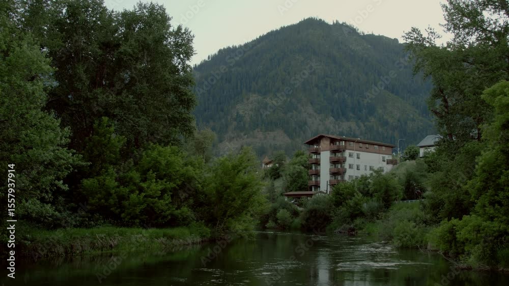House in Green Mountains by the river – Leavenworth Outdoor Scenic Landscape. House in green mountains of Leavenworth, with a clear river flowing nearby House in Green Mountains by the river – Leavenworth Outdoor Scenic Landscape. House in green mountains of Leavenworth, with a clear river flowing nearby
