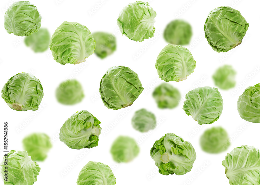 Fototapeta premium Fresh ripe cabbages falling on white background