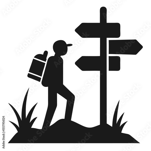 Silhouette of hiker with backpack approaching signpost suggesting directional choices