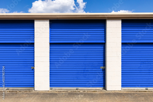 Exterior self storage units with bright blue doors