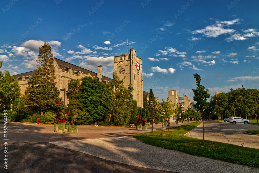 Fototapeta premium 10 Aug 2024 - University of Guelph, ON, Canada. The university buildings seen from the main entrance of the university.