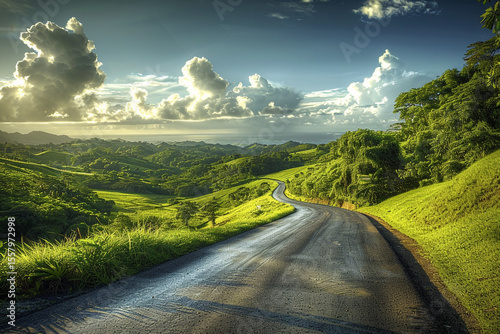 Sunlit Countryside Road Through Rolling Hills and Open Skies

