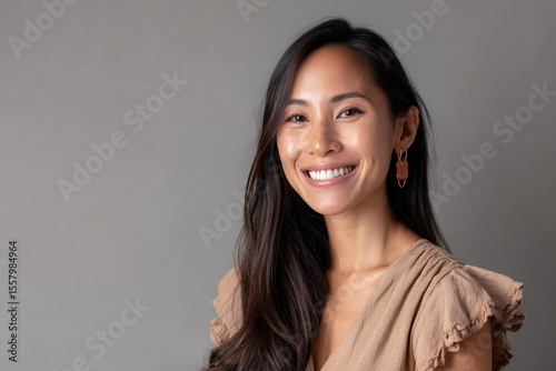 friendly recruiter portrait positioned in left corner of frame with light gray background