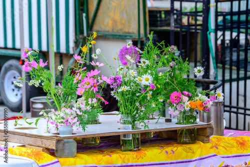 cut flowers for sale at a farmers market in early summer season shot  at the landsdown farmers market in ottawa ontario